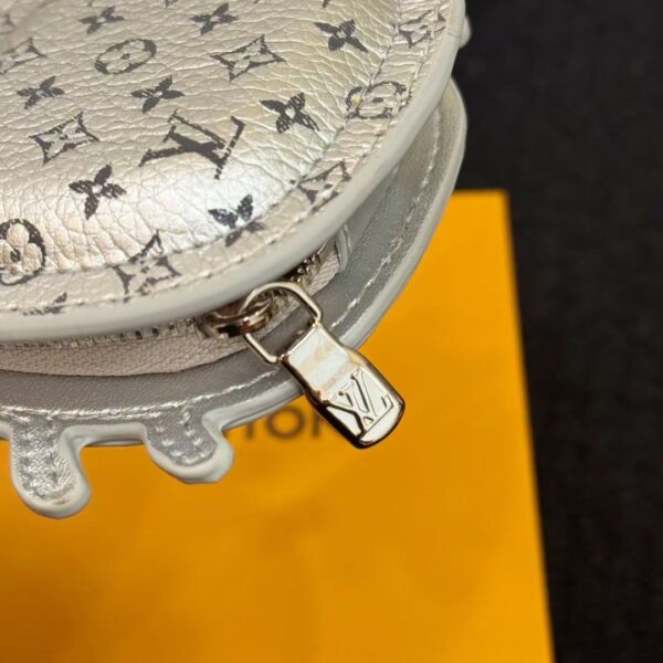 Top angle showing zipper and clasp details of luxury crab-shaped leather pouch accessory.