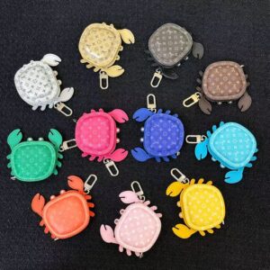 Colorful collection of luxury crab leather keychain pouches in 10 colors